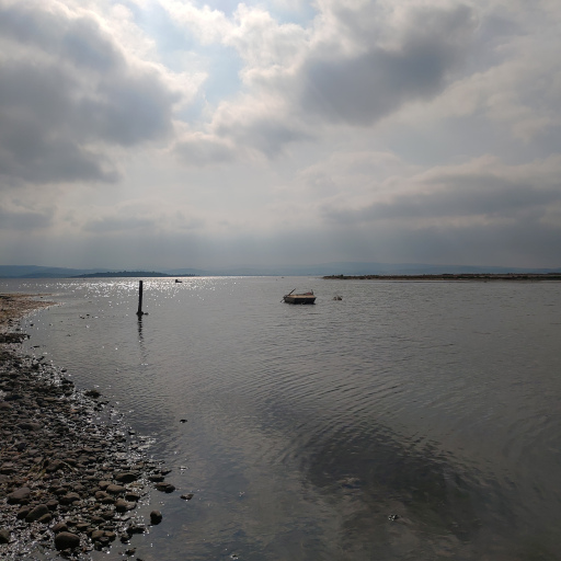 A boat and horizon line in Gülbahçe Bay